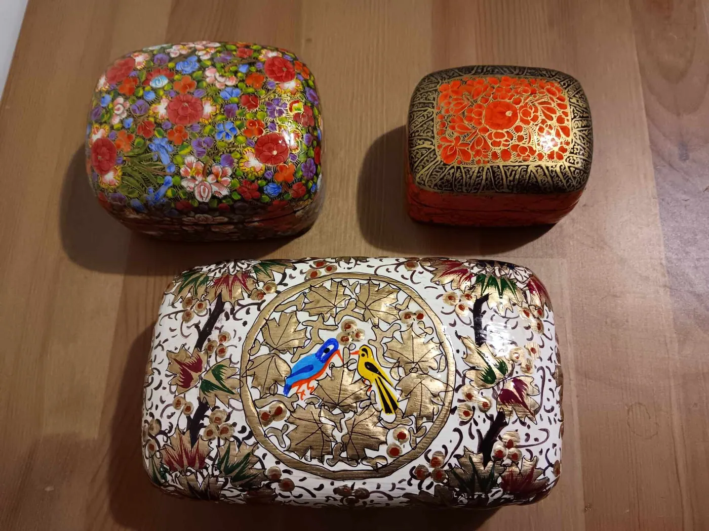 Three hand-painted Kashmiri papier-mâché boxes